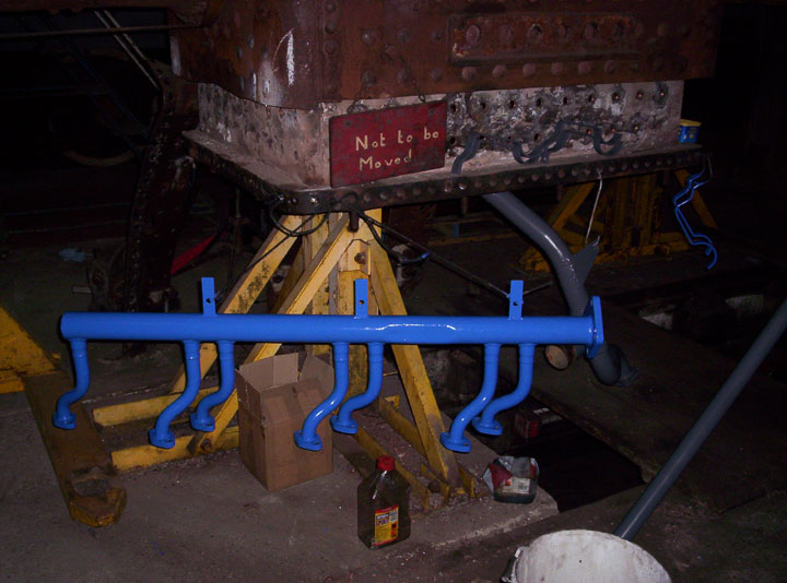 Half of the water return pipe work now in french blue, Photo by Andre Kent
